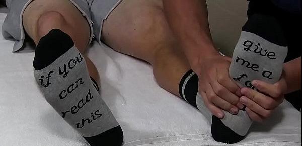  Inked hunk Clint has socks and feet sucked while jerking off